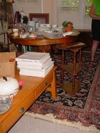 Rugs, tables, plates, china, all to be unpacked and prepared for display