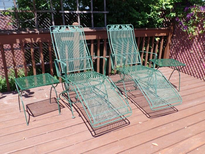 7pc green wrought iron patio set. All chairs are rockers - also has 2 matching rocking lounge chairs, 2 side tables & umbrella stand 