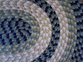 Braided rug in greens with small coordinating rug