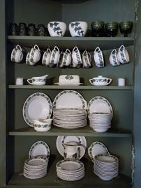 Set of green ivy on white dishes