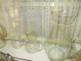 several clear pitchers