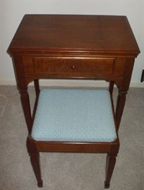 $395.                                                                                  
Early 1940's Singer Sewing Machine Cabinet, with Janome Sewing Machine, and Stool. This walnut cabinet and stool have been completely restored. .