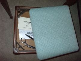 The removable seat cushion lifts up to offer room for organizing your supplies. The cushion has been reupholstered with a durable vibrant material. 