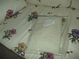 Wicker Loveseat Cushion includes a washable white replacement cover.