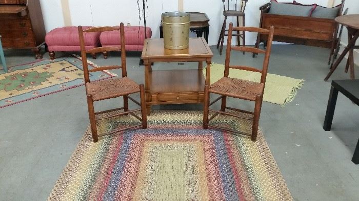 braided rug (Crate & Barrel)  $ 35,  2 old low chairs w rush bottom seats  $ 45 each, end table  $ 100, rug in left corner  $ 50