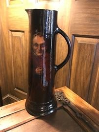 Tall Weller "Louwelsa" Pitcher with handpainted monk.