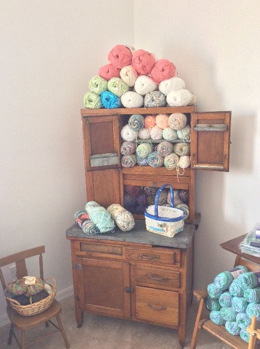 Antique cabinet.Yarn and craft supplies. 