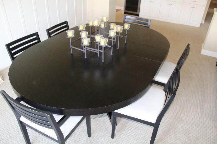 With two extensions, the table is 7 feet long. Each extension is 15".