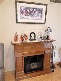 Faux fireplace/heater and decor. Clocks. Lamps
