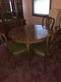 Dining room table and 4 chairs; includes 2 leafs and pads