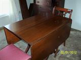 Dining room table with three leaves and pads