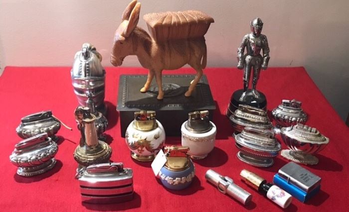 Many collectible table cigarette holders and lighters.