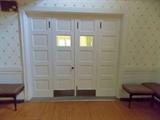 bifold 4 panel vintage doors, benches 100 year old maple wood flooring vintage moulding