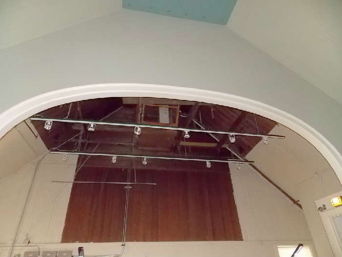 Stage lighting track  lighting vintage moulding exit sign emergency light wood paneling