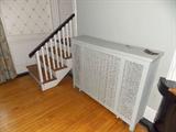 steam radiator cover staircase railing 100 year maplewood flooring vintage trim