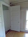 paneled wood door vintage trim maple wood flooring