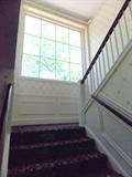 large wavy glass window staircase carpet runnner hand rail