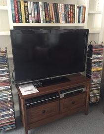 42" Panasonic
Modern Wood TV stand
Over 200 DVD's, Asst CD's and Books 