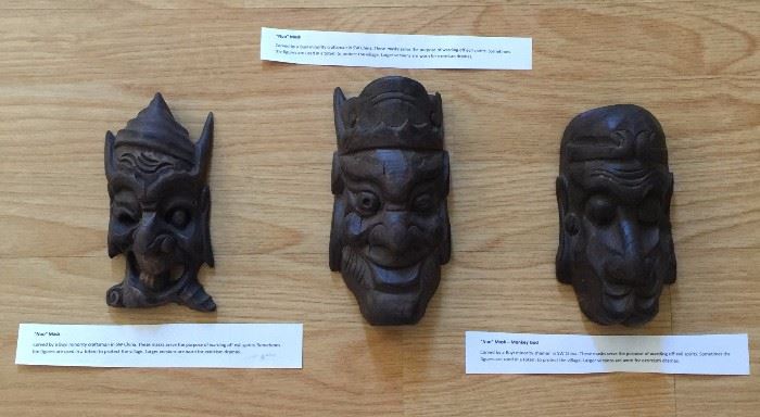 "Nuo" Carved Masks: carved wooden masks used for protection from evil spirits; larger ver used in exorcism dramas, Guizhou, PR China
