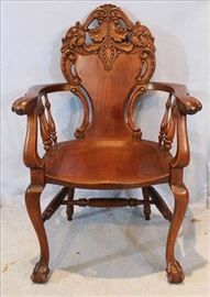 118 - Mahogany heavily carved arm chair attrib. To Horner, 41 in. T, 26 in. W, 18.5  in. D.