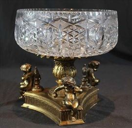 197 - Cut glass center bowl with bronze base and cherub mounts, 12 in. T, 11 in. D.