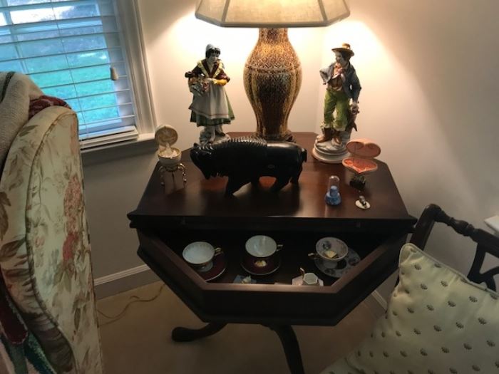 unusual table, pair of figurines, signed buffalo, and other china items