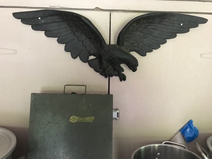 Cast iron eagle and a vintage first aid kit