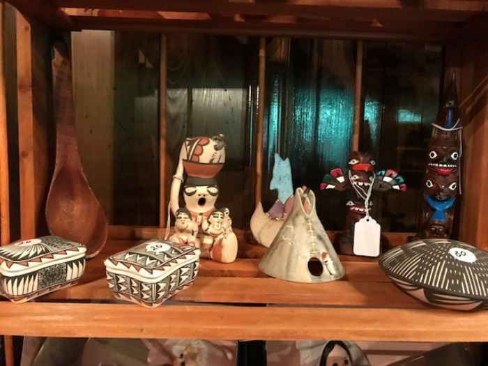 Collection of southwest items and Alaskan totem poles