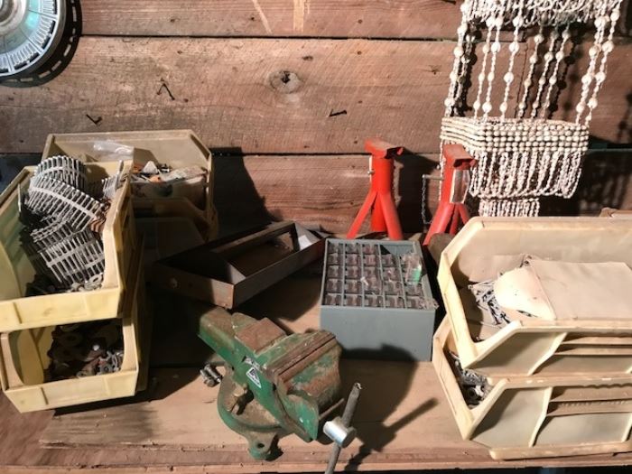 Vise, bins of stuff, and a neat 60's era macrame and shell plant hanger.