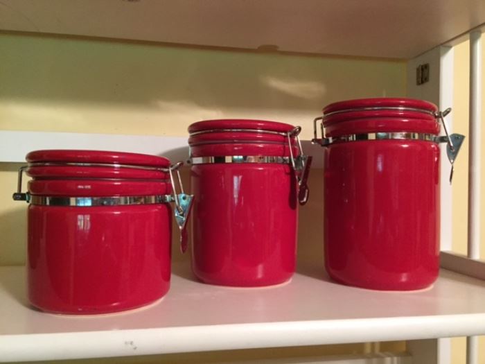 3 red canisters