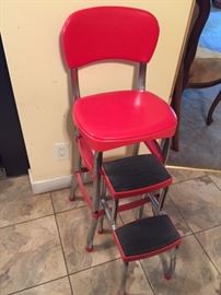 Cute red kitchen stool with pull out steps in near perfect shape