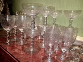 Stunning etched set of Antique water glasses, wine glasses, sorbets, candlesticks and some serving pieces.