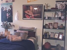 Assorted frames & black shelf
Twin bed & linens + posters