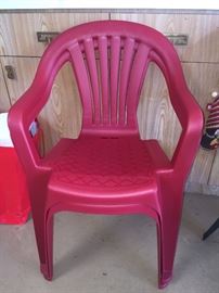 2 red resin smaller chairs