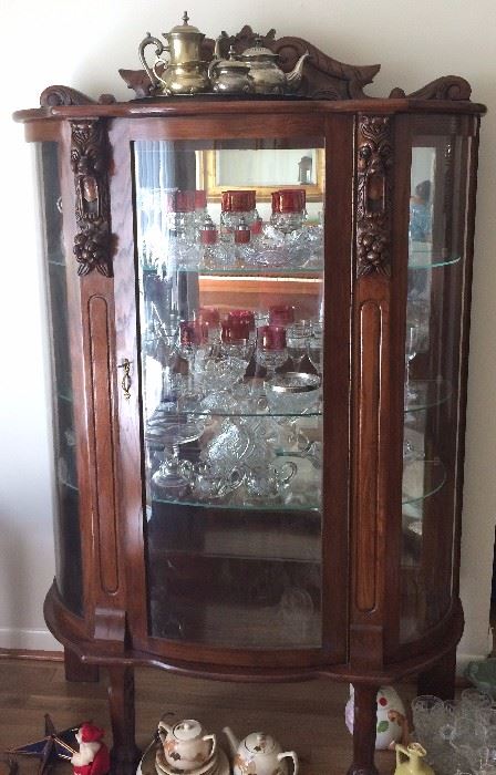 Antique curved glass china cabinet, cut to clear cranberry glass, tea service
