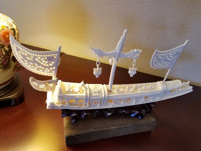 Ivory carving ship, on wood stand.