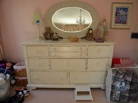 This dresser and mirror are great. Better in person than this picture. Part of furnishings in two girls rooms that are for sale. There are 2 end tables that match this dresser.