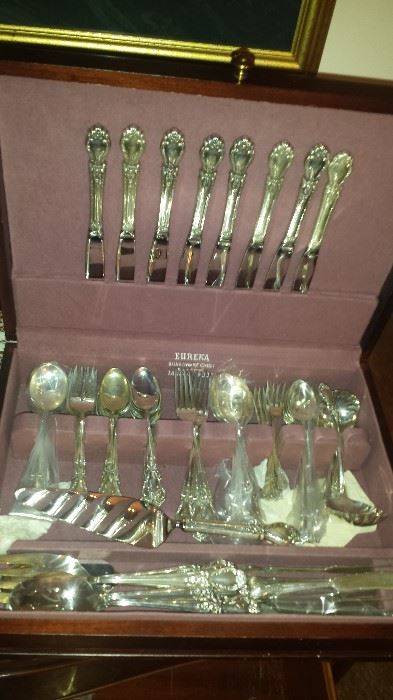 Sterling international "Brocade "Pattern flatware  actual number pieces is 99 pieces including serving pieces.  Being sold as a set.  about 25% of set is Monogrammed with a "w"