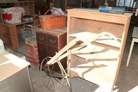 Farm tools, drink crates, bookcase