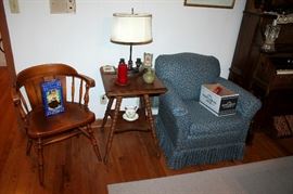 Upholstered armchair, antique table, lamp, wood armchair
