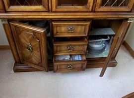 High quality (Stanley Furniture), solid wood china cabinet with glass shelves, lighted, brass lattice inserts and hardware, lots of bottom storage.  52" wide, 83" tall, 15-1/2" deep.