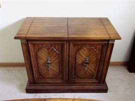 High quality (Stanley Furniture), solid wood buffet server.  Top flips open for additional serving space.  One drawer, storage behind double doors.  37" wide, 19" deep, 30" tall.  Top opens to 59".