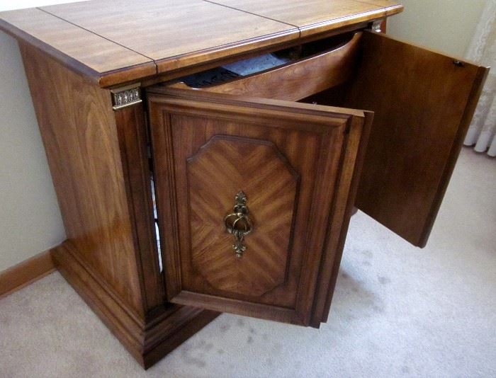 High quality (Stanley Furniture), solid wood buffet server.  Top flips open for additional serving space.  One drawer, storage behind double doors.  37" wide, 19" deep, 30" tall.  Top opens to 59".