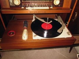 Blaupunkt Valencia Deluxe console stereo.  Mini bar with tufted walls, mirrored bottom, side storage for records, radio does not change channels, turntable works and sounds great. Cabinet in great condition.