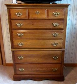 Solid wood, 5 drawer chest, brass hardware. 34" wide, 17" deep, 49" tall.
