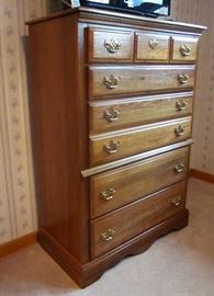 Solid wood, 5 drawer chest, brass hardware. 34" wide, 17" deep, 49" tall.