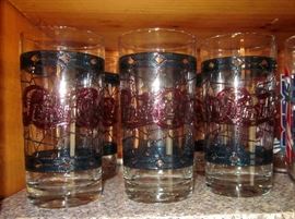 Retro Pepsi stained glass tall glasses (tumblers).  These are not the painted on Tiffany style.  They are the older ones with the raised texture on the outside and darker colors.  Set of four.