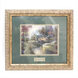 Thomas Kinkade Offset Lithograph "Stillwater Cottage": An offset lithograph titled Stillwater Cottage after Thomas Kinkade. The lithograph is matted in forest green and presented in a gilt frame. The lithograph is the Library Edition created exclusively for Home Interiors and Gifts.