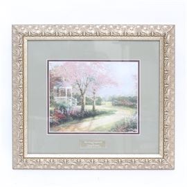 Thomas Kinkade Offset Lithograph "Morning Dogwood": An offset lithograph titled Morning Dogwood after Thomas Kinkade. The piece is matted in grey and framed in an ornate gilt frame. The print is part of the Library Edition; printed exclusively for Home Interiors. The piece comes with a COA.