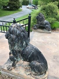 Pair of Huge Seated Bronze Lions with One  Paw resting on a Sphere.